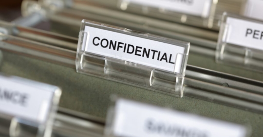 File folder labeled "confidential."